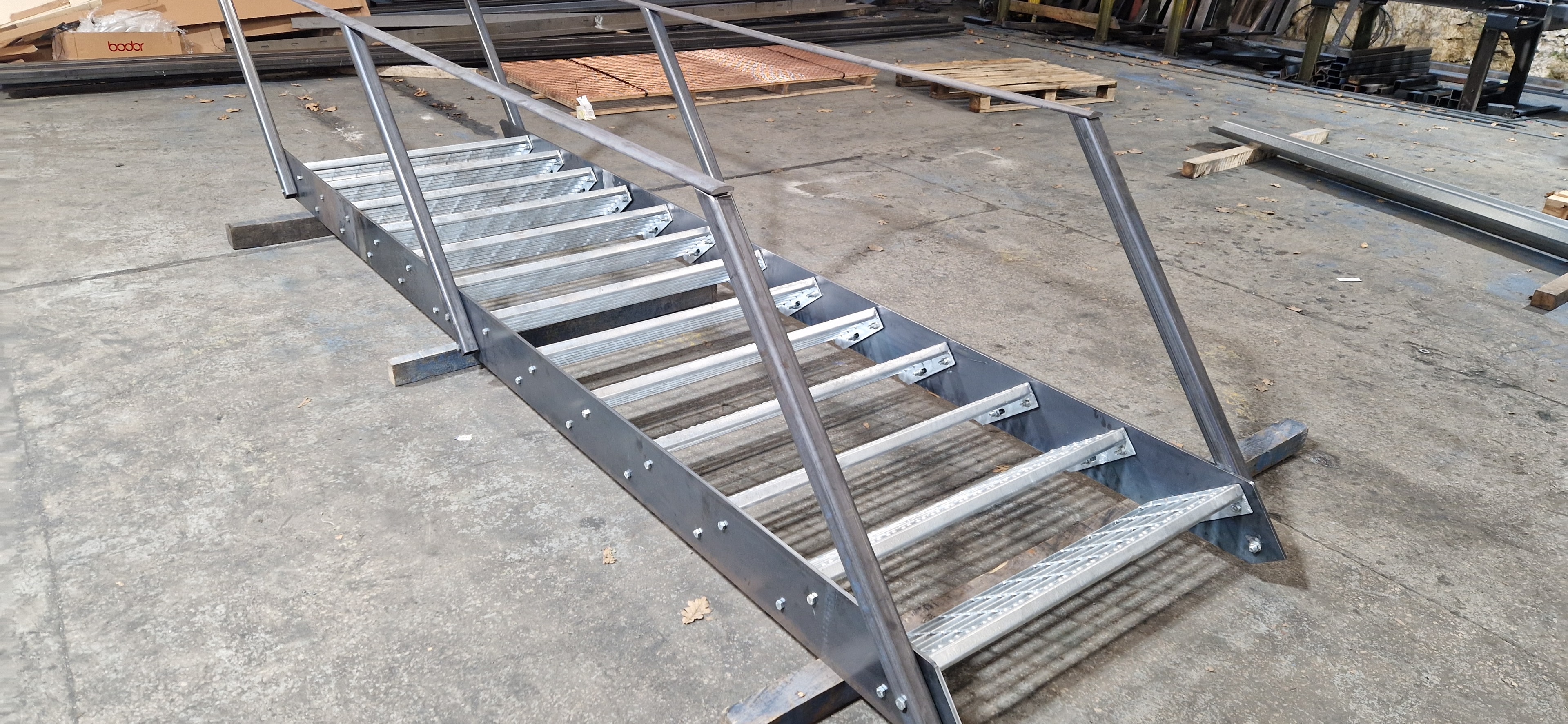 Steel staircase with handrails