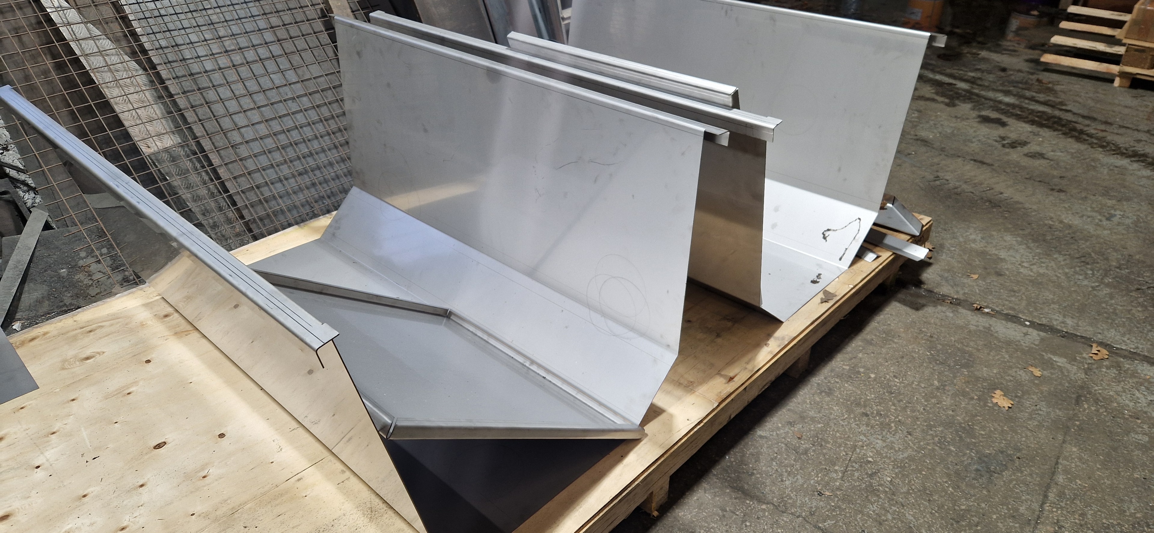 Stainless steel press brake bent components on pallet
