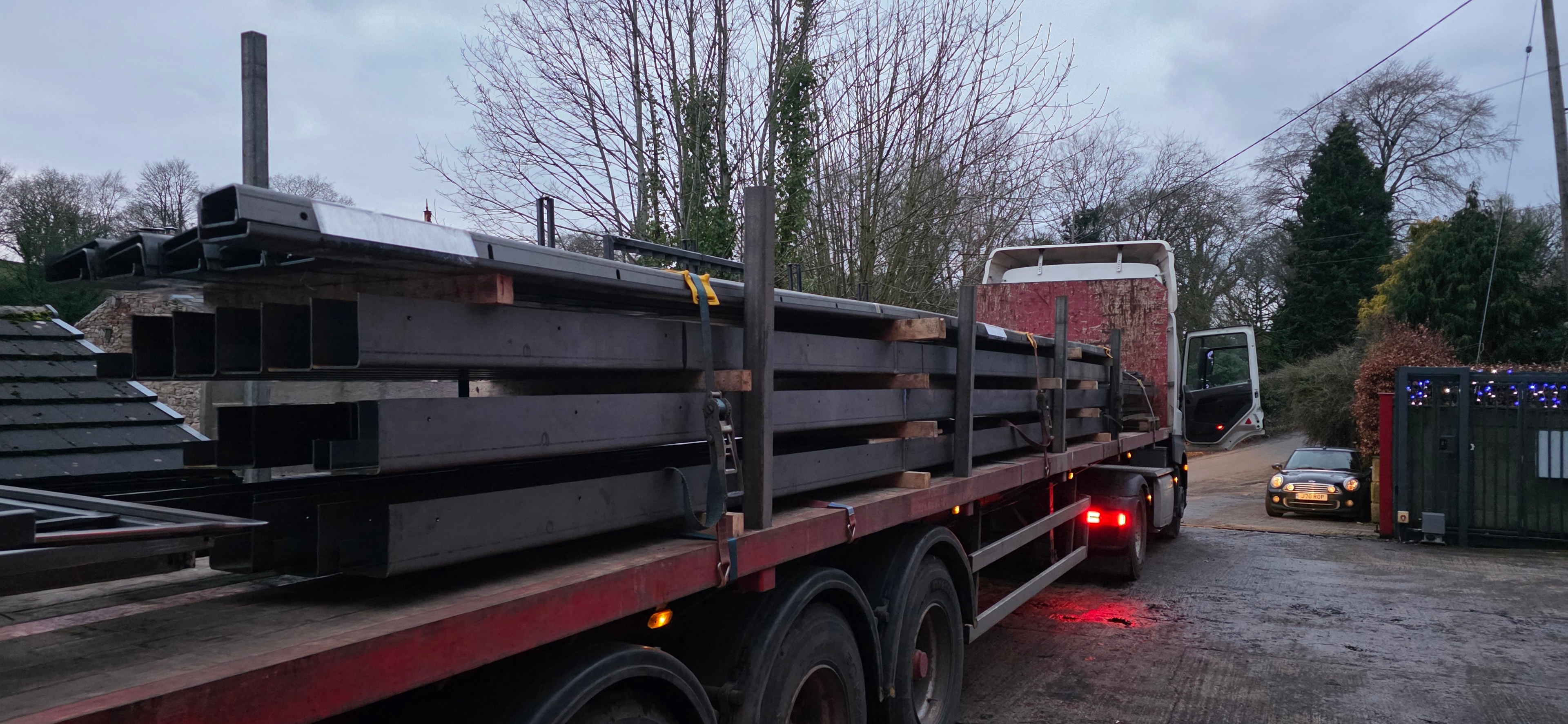 Steel sections loaded on flatbed delivery truck